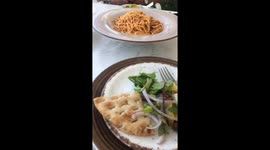 Curious cat watches guests at bayside restaurant in Protaras, Cyprus