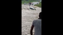 Car swept away by overflowing drainage canal in India