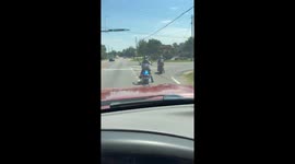 4 Year Old Ratchet Strapped Onto a Motorcycle