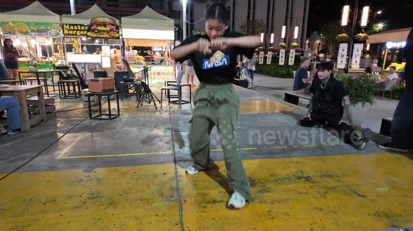 Discover Chiang Mai's Hidden Talent: Young Lady Break Dancer at Kalare Centre in the Night Bazaar