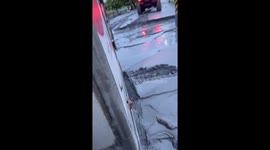 Off-road jeep rescues lorry stuck in mud after typhoon in Taiwan