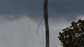US: Funnel cloud captured during stormy wetaher in Buena Ventura Lakes, FL
