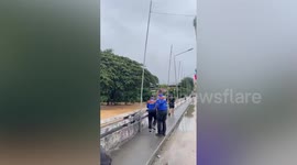 Typhoon Bualoi floods drag resident away before being rescued in Thailand