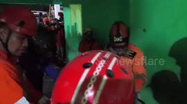 Rescue teams search for 15 pupils still trapped under collapsed school in Indonesia