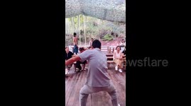 Acrobat's water tank mishap leaves audience in stitches