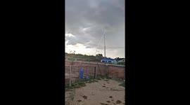 Waterspout rises from storm clouds over calm waters in Heilongjiang, China