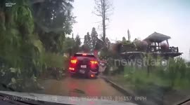Landslide buries car as typhoon lashes Vietnam