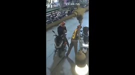 Police caught on camera 'taking backhander' from tourist pulled over for motrocycle offence