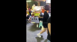 Patient pet dog waits on massage chair for his turn for a rub down