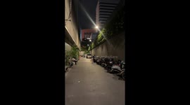 Isolated rain shower surprises Bangkok street, Thailand
