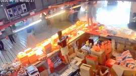 Typhoon Matmo rips through market blowing worker from counter