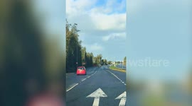 Rogue trampoline rolls across dual carriageway during Storm Amy