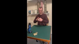 Man juggles cards between hands as he shuffles deck with precision