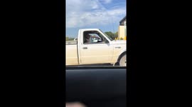 Labrador Retriever sits calmly in a Ford Ranger in Lawson, Missouri, USA