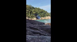Águia Helicopter Rescues Man Trapped on Rock Formation on the Coast of Guarujá (Brazil)