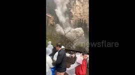 Huge rockfall at scenic waterfall in China sends tourists scrambling to safety