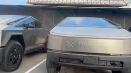 Tesla Cybertrucks lined up outside SpaceX Starbase production facilities in Boca Chica, Texas