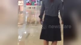 Floodwater pours into luxury department store Harvey Nichols in Manchester