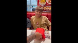 Youngster delighted to receive new smartphone as gift from cousin