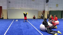 Girls 'save' boy from falling gymnastic cushion by kicking fitness balls