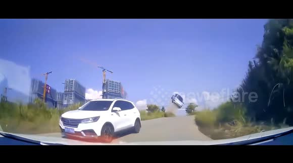 Car sent 4 metres into air after losing control on slope and narrowly ...