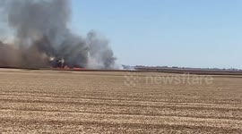 US: Wildfire Sweeps Through Cornfield in Illinois