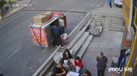 Bicycle crash startles pedestrians on a street in Shanxi, China