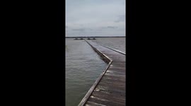 Pier boardwalk flooded by high tide in Emerald Isle, North Carolina