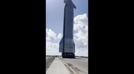 Starship 38 is rolled out from Starbase and stacked onto the Booster 15.2 prior to Flight 11 in the Starship programme.