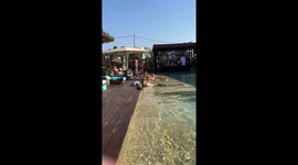 Filming the pool on my girls trip at Oku in Ibiza then spotting a very hungover guy!