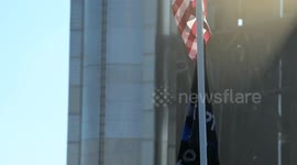 Flags wave at Starbase as the Starship is stacked onto Booster 15.2 prior to Flight 11