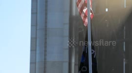 (Image 2) Flags wave at Starbase as the Starship is stacked onto Booster 15.2 prior to Flight 11