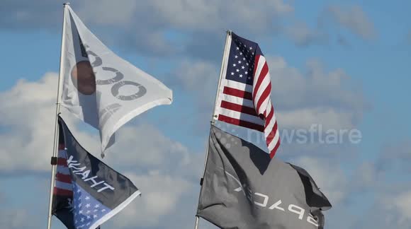 (Image 4) Flags wave at Starbase as the Starship is stacked onto ...