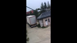Truck Driver Hits Roof of Storage Space