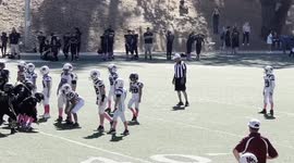 Raydon Pratt aka Superman making a hard tackle playing for the UM Jr Rattlers Football team Number 23.