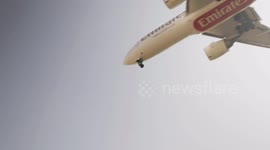 An Emirates airplane coming into land at barcelona airport in spain
