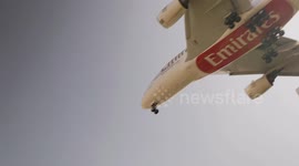 An Emirates airplane coming into land at barcelona airport in spain
