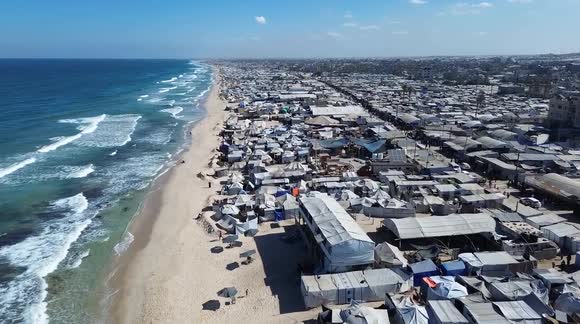 DRONE - Thousands of displaced Palestinians remain in crowded tents ...