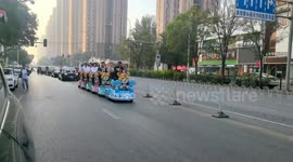 Unusual wedding procession with kiddie rides in Gansu, China