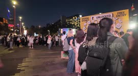Huge crowds surround Tumbalong Park to hear Chinese singer Tia Ray perform at SXSW, Sydney, Australia
