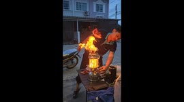 Gas lamp catches fire on table outside home
