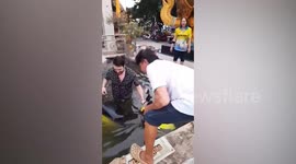 Bungling tourist soaked when he crashes rented scooter into pond