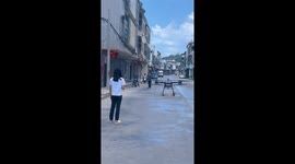 Drone lifts new water tank onto hard-to-reach roof of home in China