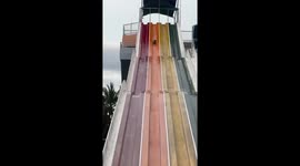 Boy does a somersault when waterslide throws him in the air