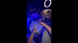 Drummer lights up the night with fire-powered performance