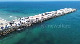 Displaced Palestinians take shelter at destroyed port in Gaza