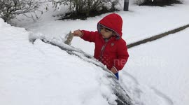My little champ helping dad in freezing cold weather in Manchester