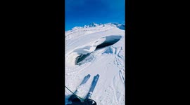 Extreme ski descent into glacier cave in Zermatt, Switzerland