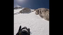 Snowmobile mishap on mountain slope in Laramie, Wyoming, USA
