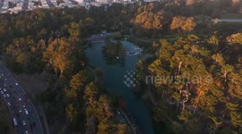 US: Golden Gate Bridge and San Francisco skyline glow at sunset